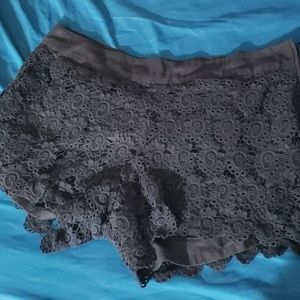 Black cotton flower print overlay shorts